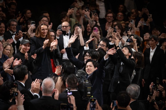 The Exit 8 team responds to a standing ovation at Cannes